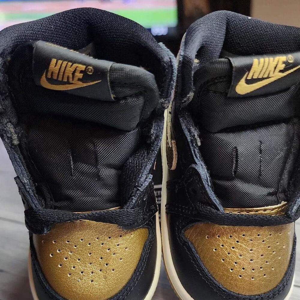 Jordan Black and Gold Trainers